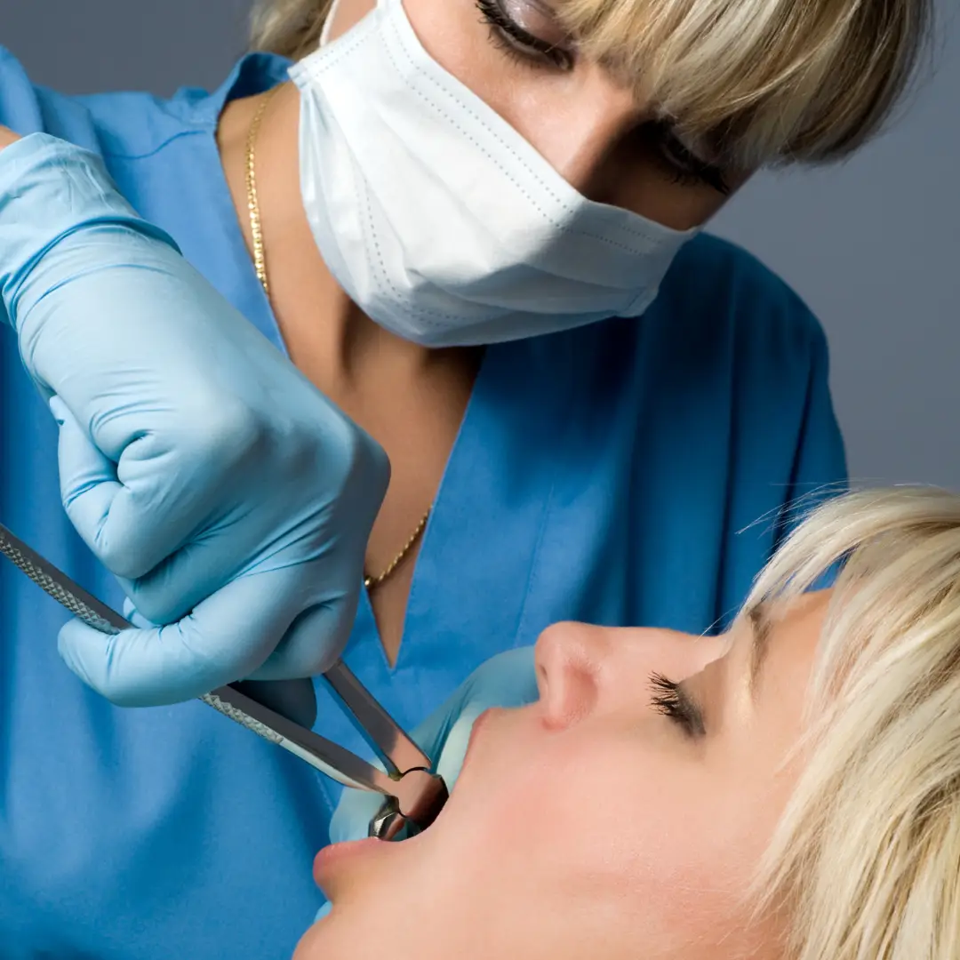 a person is getting their extracted by a dentist