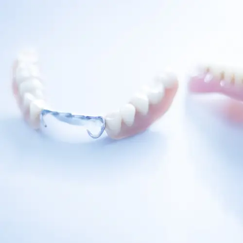 a pair of partial dentures Sherman TX on a white surface